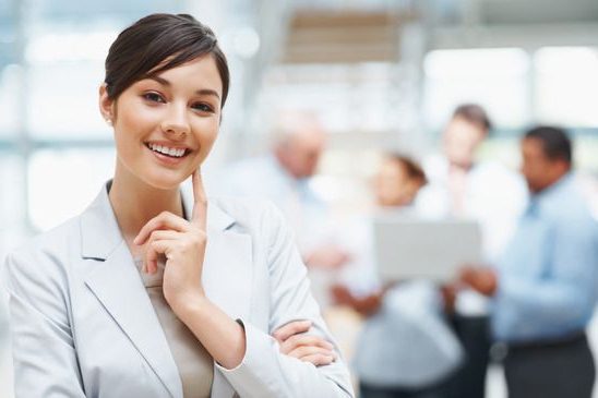 photodune 202687 smiling cute business woman with colleagues at the back xs e1627066612324 مؤسسه آموزش عالی خراسان